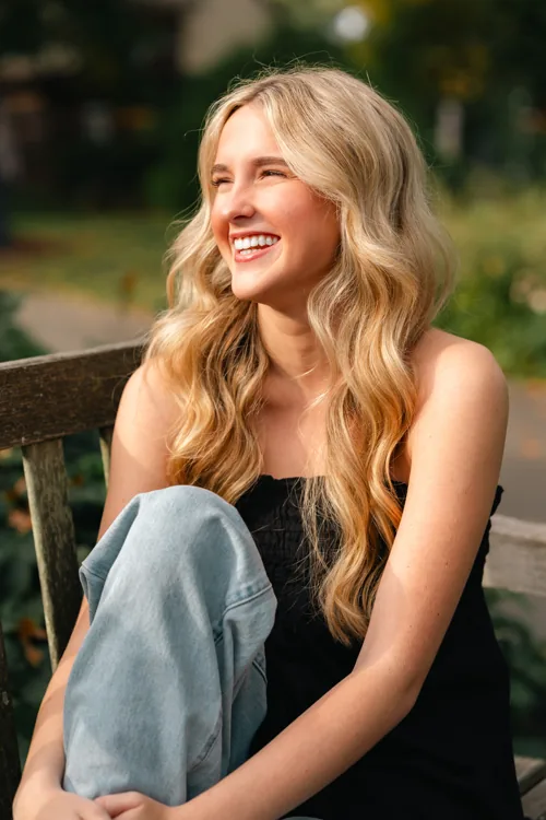 Senior portrait seated outdoors