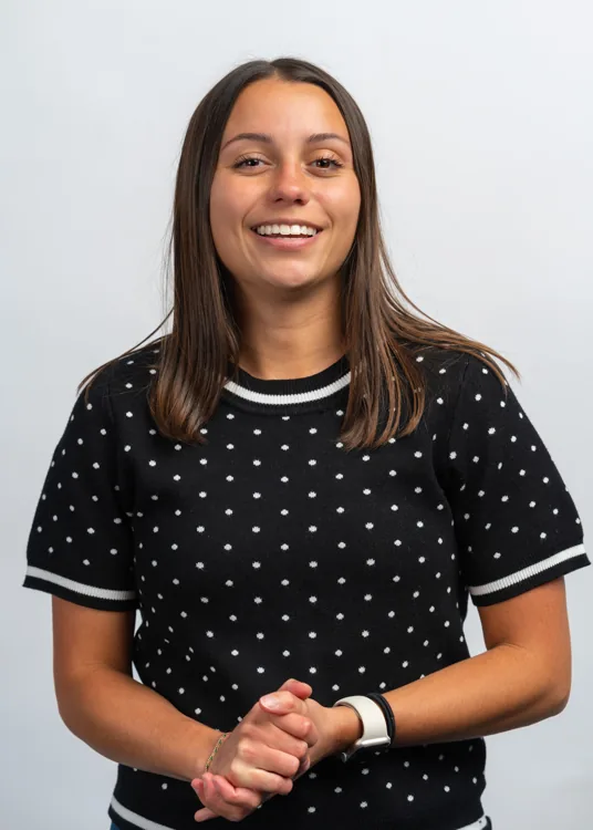Studio portrait in a patterned black top